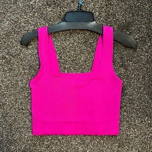 Bright pink cropped workout top